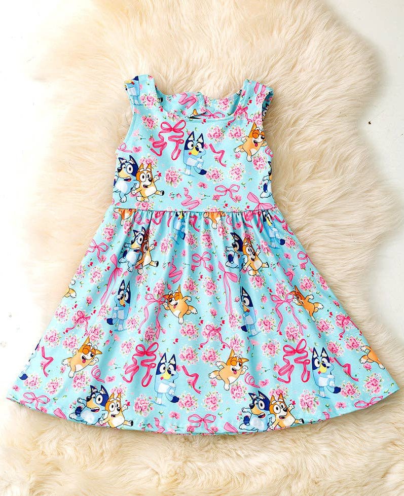 Lt. blue Multi - printed character dress with open back and bow. - Adalynn Leanne