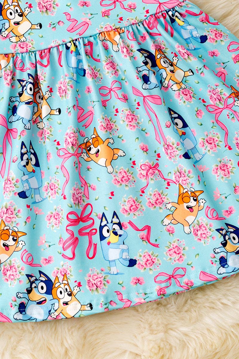 Lt. blue Multi - printed character dress with open back and bow. - Adalynn Leanne